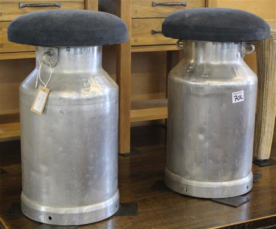 Pair of aluminium milk churns with upholstered tops